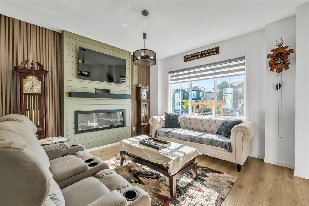 7 Emberside Park, Cochrane, AB - Indoor Photo Showing Living Room With Fireplace