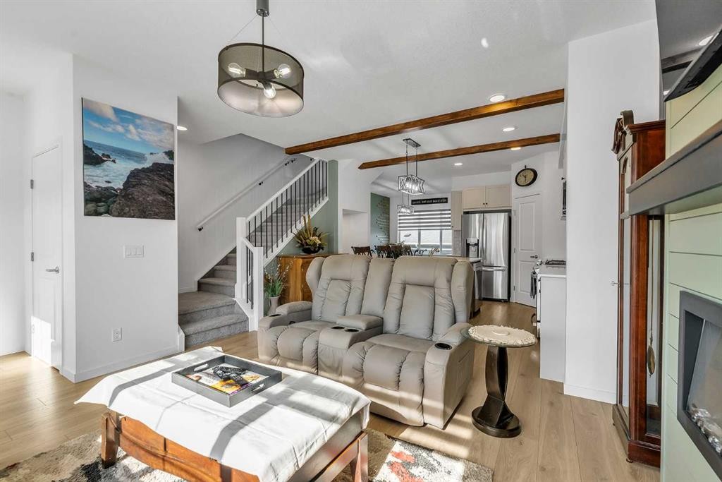 7 Emberside Park, Cochrane, AB - Indoor Photo Showing Living Room With Fireplace
