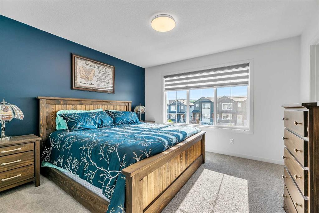 7 Emberside Park, Cochrane, AB - Indoor Photo Showing Bedroom