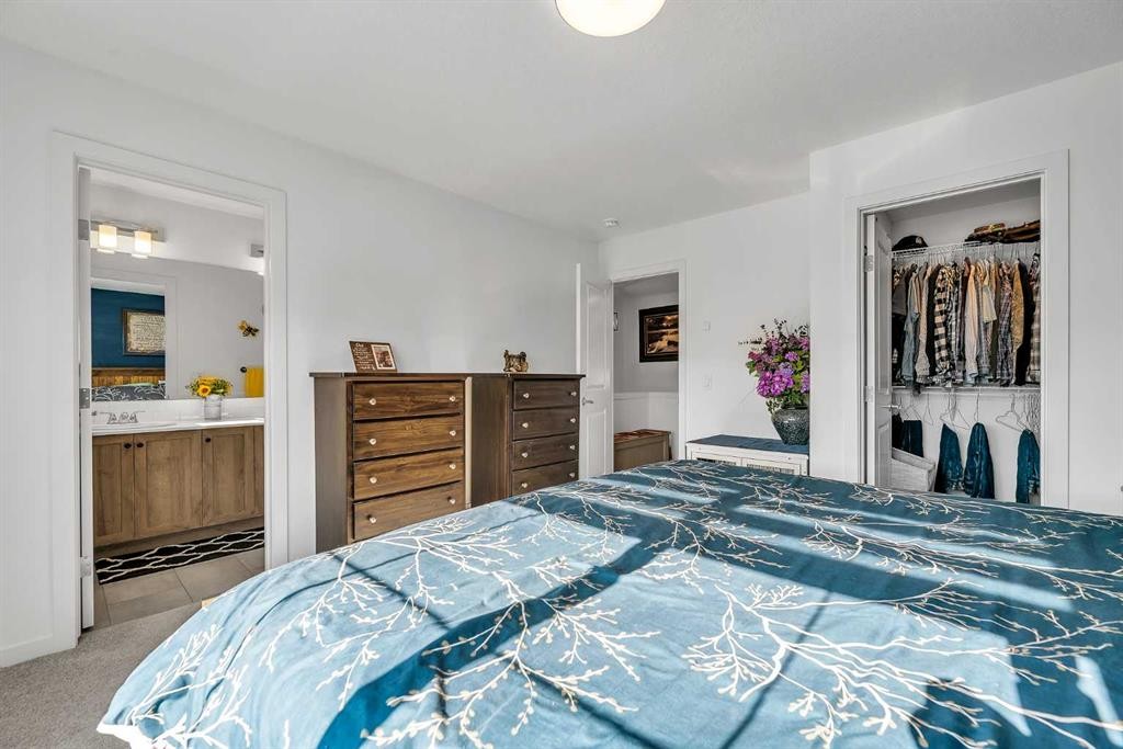 7 Emberside Park, Cochrane, AB - Indoor Photo Showing Bedroom