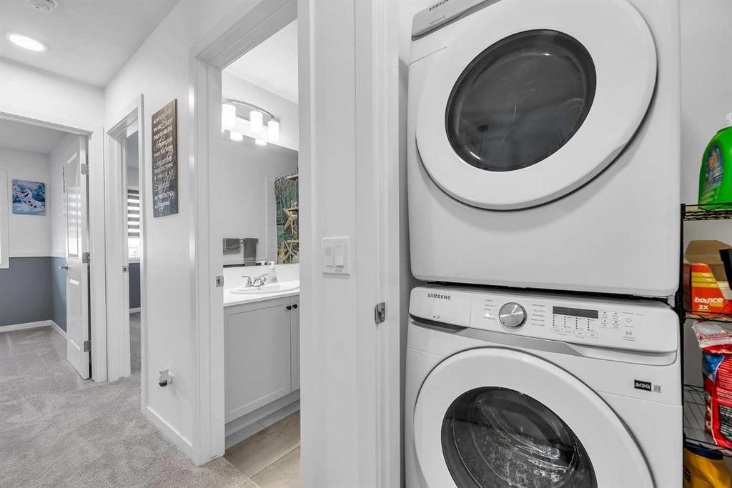 7 Emberside Park, Cochrane, AB - Indoor Photo Showing Laundry Room