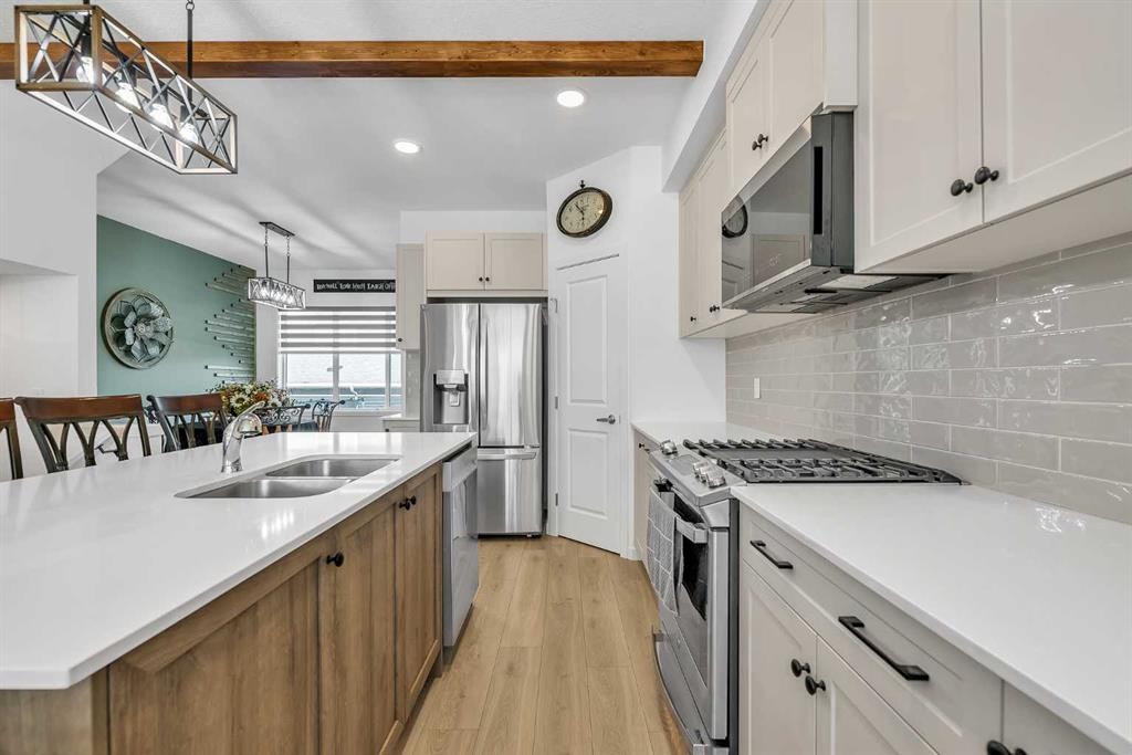7 Emberside Park, Cochrane, AB - Indoor Photo Showing Kitchen With Double Sink With Upgraded Kitchen
