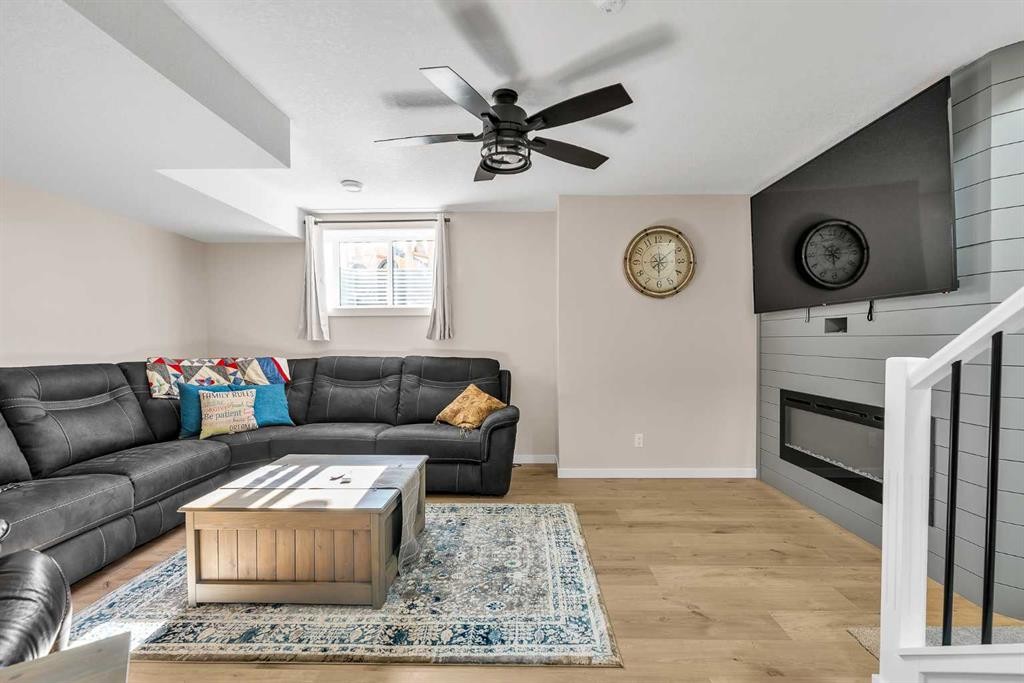 7 Emberside Park, Cochrane, AB - Indoor Photo Showing Living Room With Fireplace