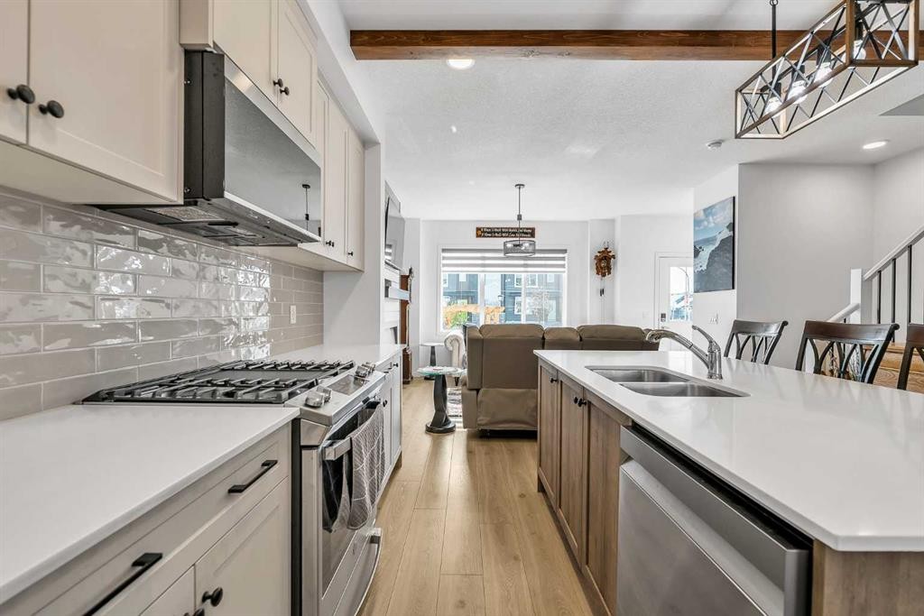 7 Emberside Park, Cochrane, AB - Indoor Photo Showing Kitchen With Double Sink With Upgraded Kitchen