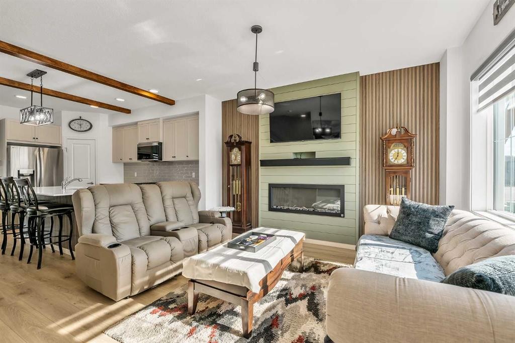 7 Emberside Park, Cochrane, AB - Indoor Photo Showing Living Room With Fireplace