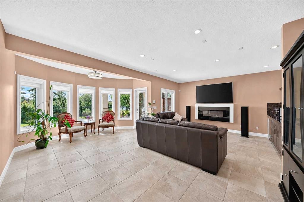 116 Panatella Rise Nw, Calgary, AB - Indoor Photo Showing Living Room With Fireplace