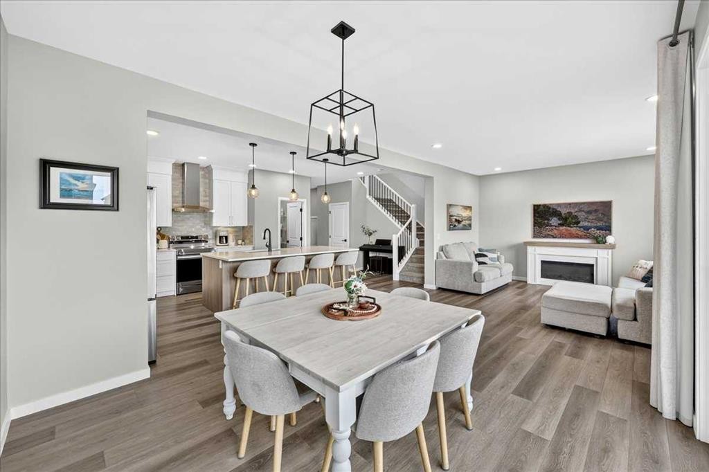 421 Magnolia Way Se, Calgary, AB - Indoor Photo Showing Dining Room With Fireplace