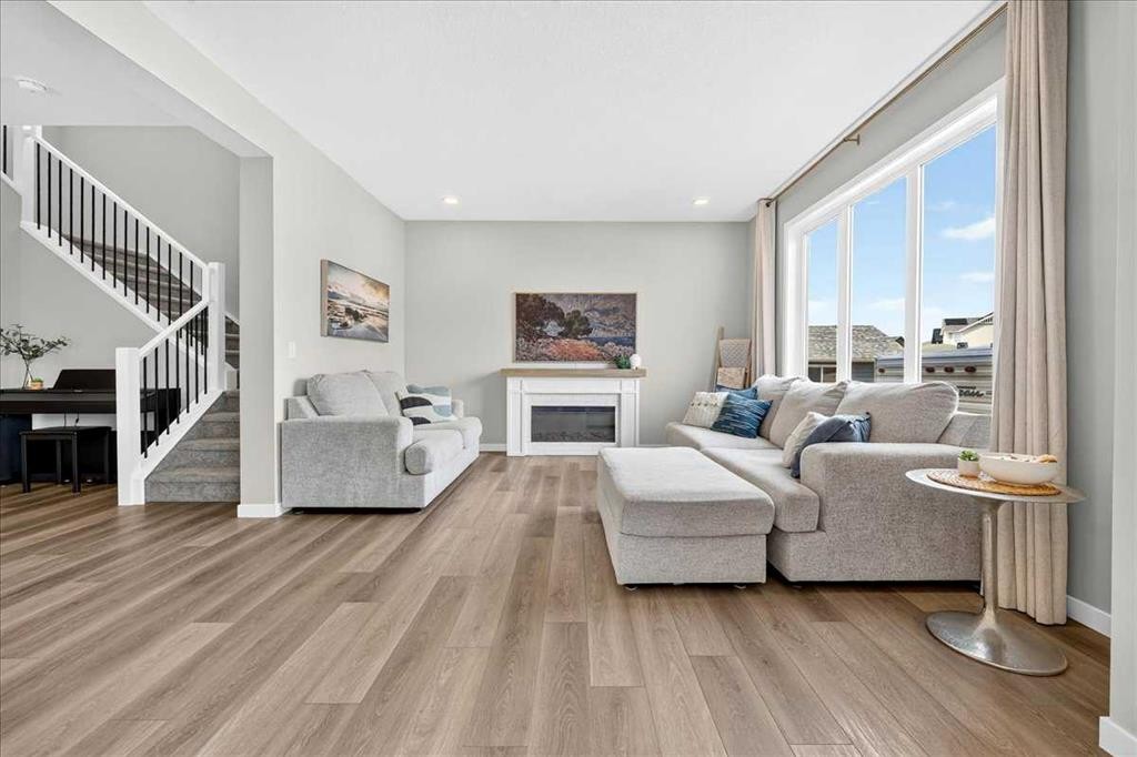 421 Magnolia Way Se, Calgary, AB - Indoor Photo Showing Living Room With Fireplace