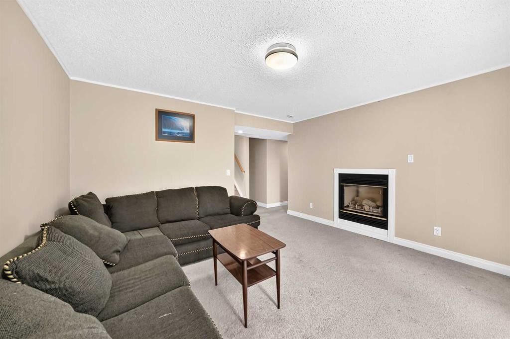 287 Harvest Oak Rise Ne, Calgary, AB - Indoor Photo Showing Living Room With Fireplace