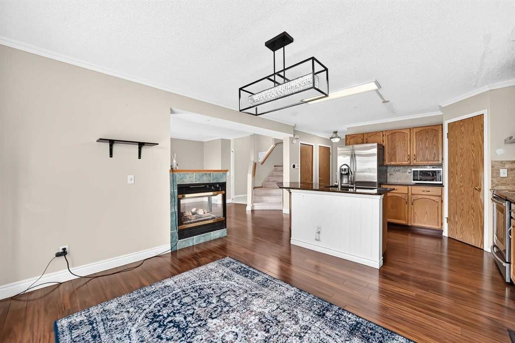 287 Harvest Oak Rise Ne, Calgary, AB - Indoor Photo Showing Kitchen With Fireplace