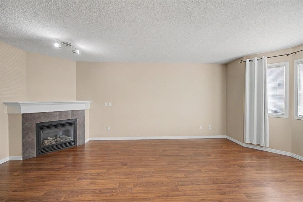 65 Royal Birch Villas Nw, Calgary, AB - Indoor With Fireplace