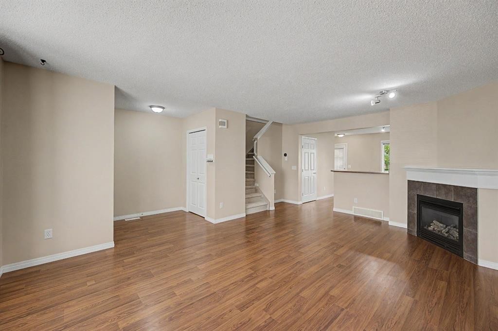 65 Royal Birch Villas Nw, Calgary, AB - Indoor Photo Showing Living Room With Fireplace
