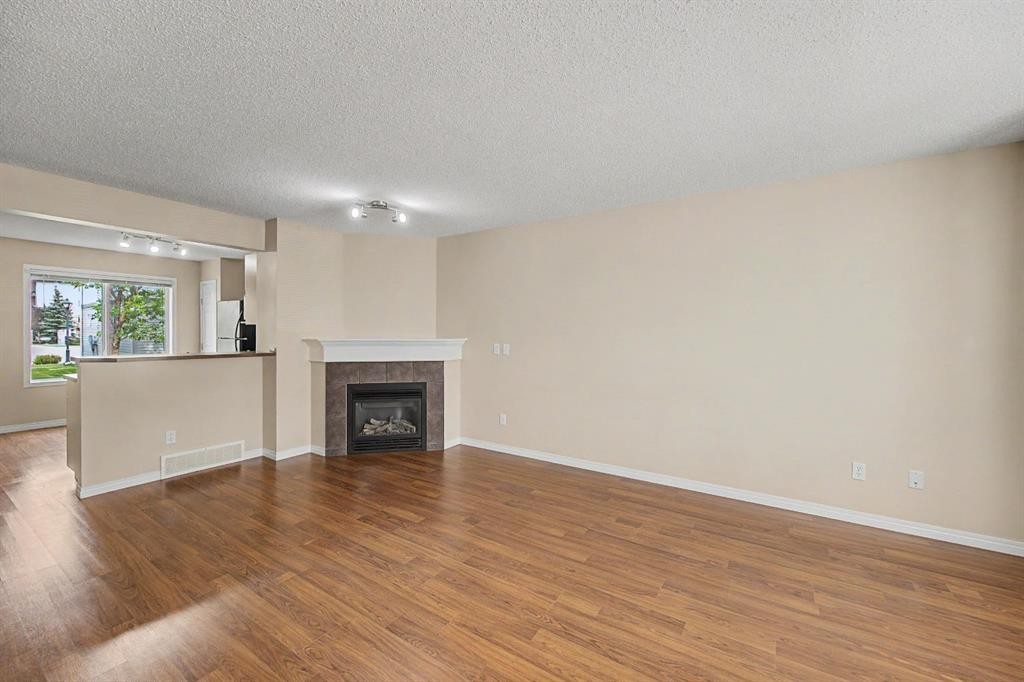 65 Royal Birch Villas Nw, Calgary, AB - Indoor Photo Showing Living Room With Fireplace