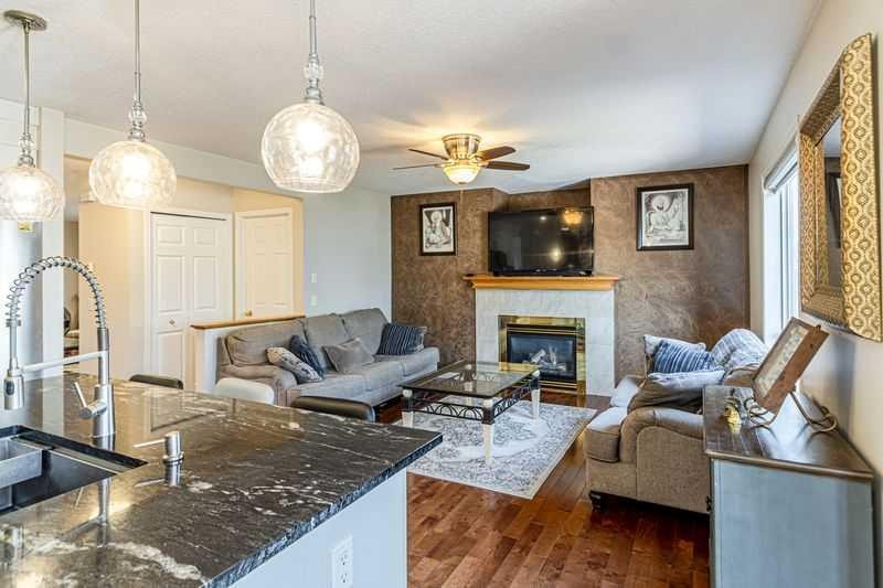 8389 Saddleridge Drive Ne, Calgary, AB - Indoor Photo Showing Living Room With Fireplace