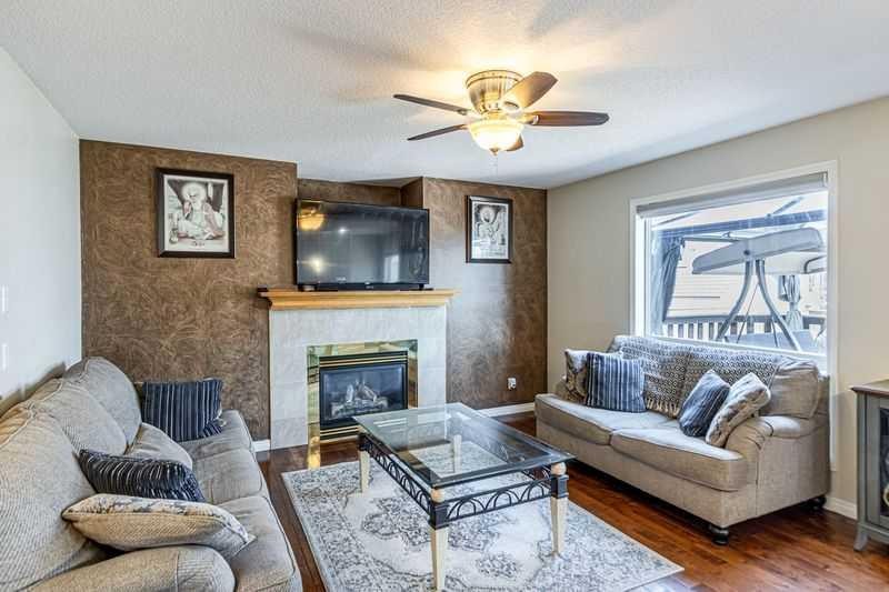 8389 Saddleridge Drive Ne, Calgary, AB - Indoor Photo Showing Living Room With Fireplace