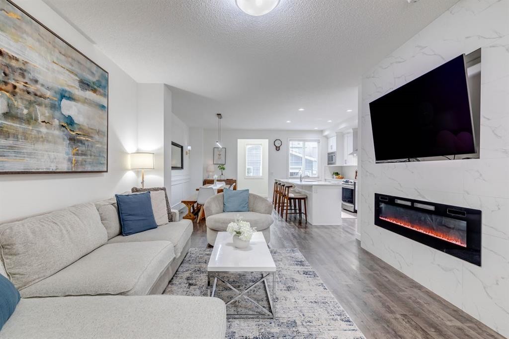 24 Corner Meadows Park Ne, Calgary, AB - Indoor Photo Showing Living Room With Fireplace