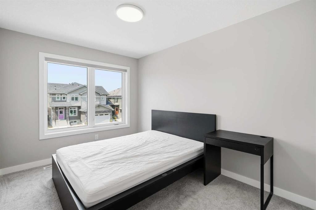 143 Belvedere Crescent Se, Calgary, AB - Indoor Photo Showing Bedroom