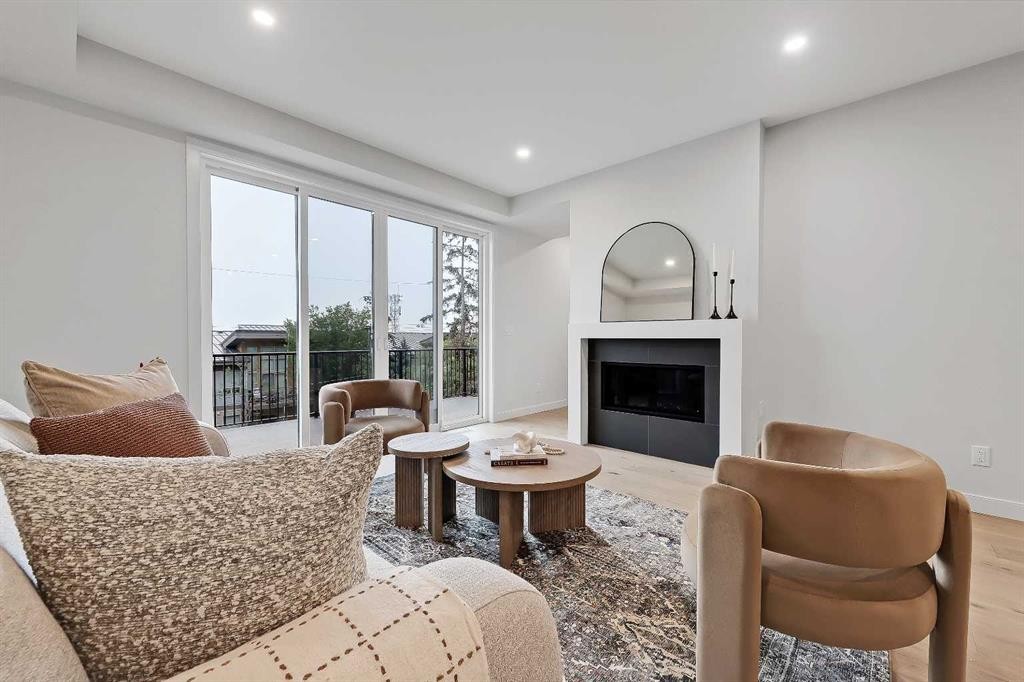 4320 Centre A Street Ne, Calgary, AB - Indoor Photo Showing Living Room With Fireplace