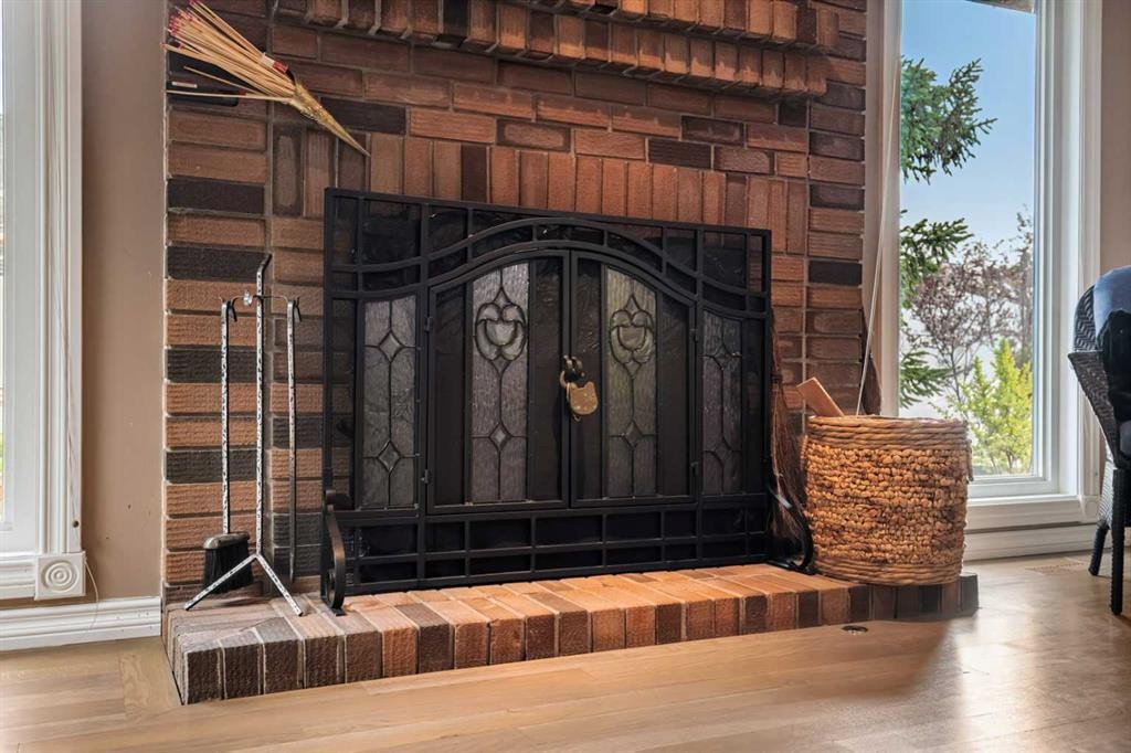 34 Cascade Place, Cochrane, AB - Indoor With Fireplace