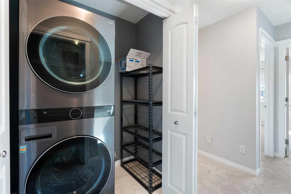 128 Silverado Way Sw, Calgary, AB - Indoor Photo Showing Laundry Room