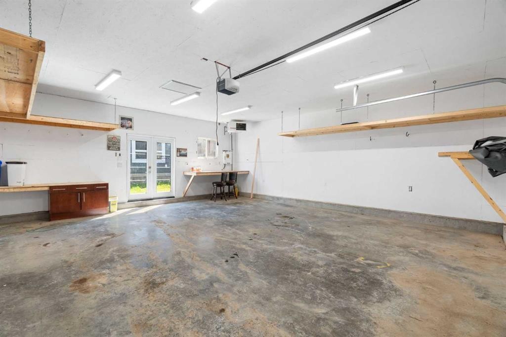 128 Silverado Way Sw, Calgary, AB - Indoor Photo Showing Garage