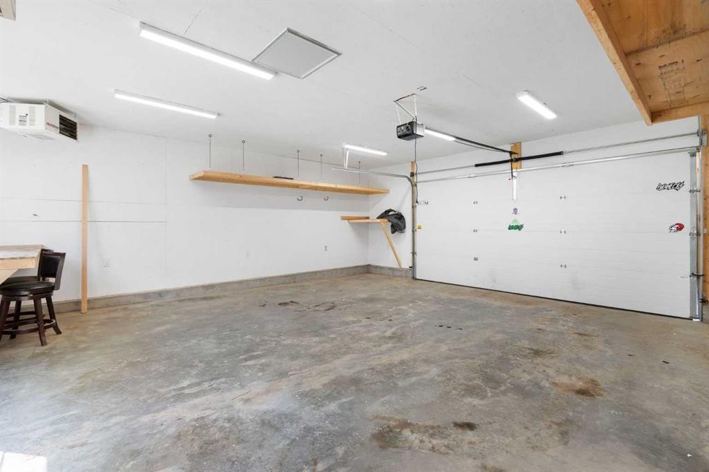 128 Silverado Way Sw, Calgary, AB - Indoor Photo Showing Garage