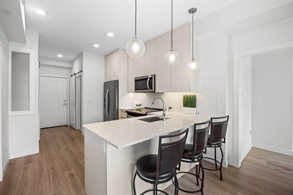 2403-76 Cornerstone Passage Ne, Calgary, AB - Indoor Photo Showing Kitchen With Double Sink With Upgraded Kitchen