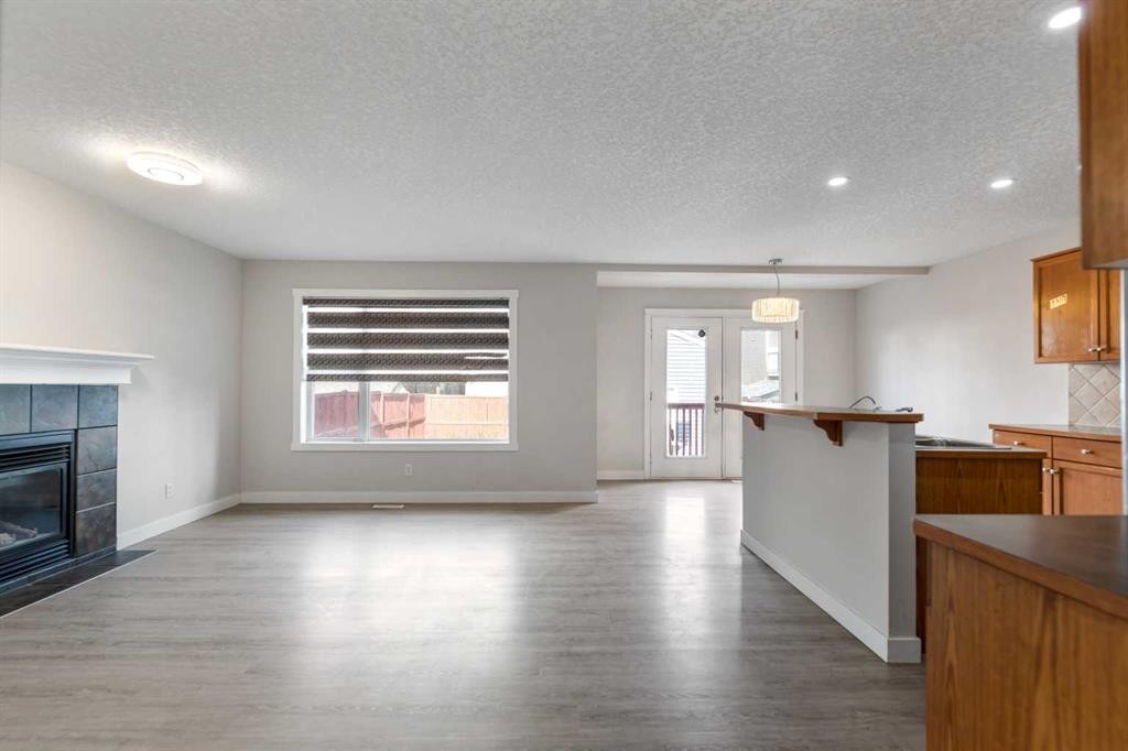 124 Saddlecrest Boulevard Ne, Calgary, AB - Indoor With Fireplace