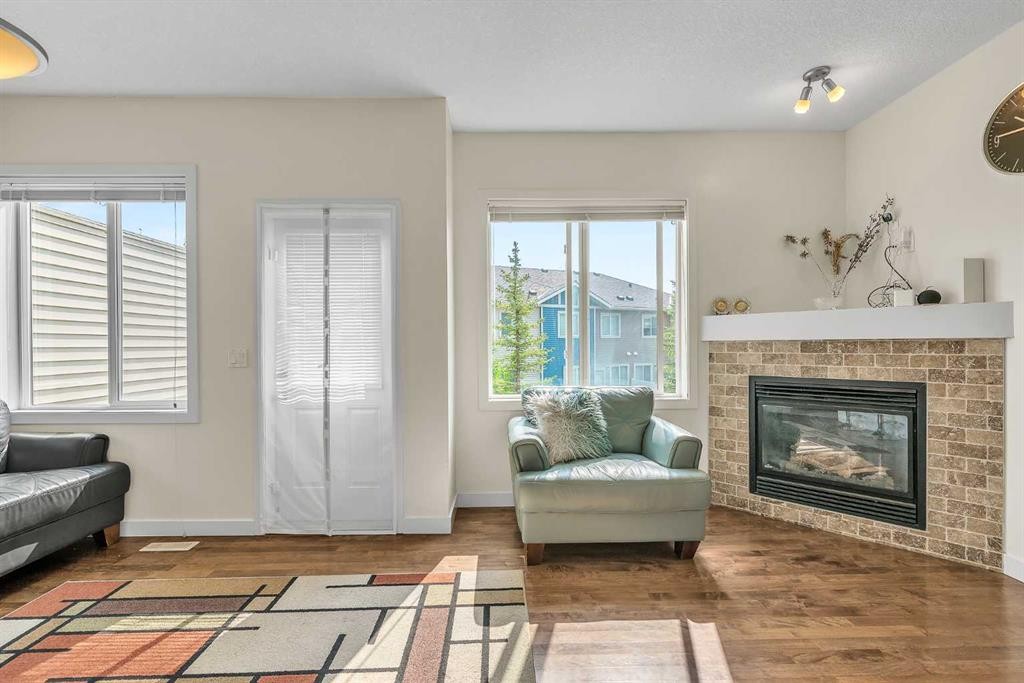 43 Sage Hill Common Nw, Calgary, AB - Indoor Photo Showing Living Room With Fireplace