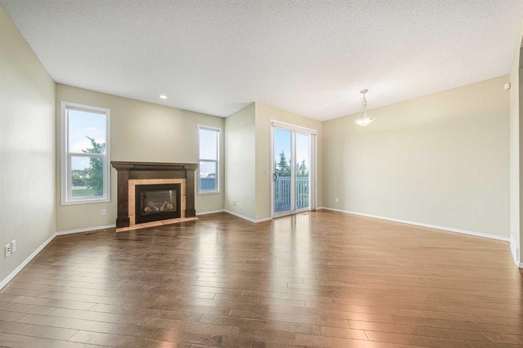 48 Panatella Common Nw, Calgary, AB - Indoor Photo Showing Living Room With Fireplace