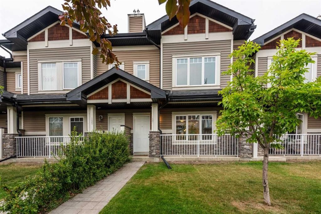 127 Prestwick Villas Se, Calgary, AB - Outdoor With Deck Patio Veranda With Facade