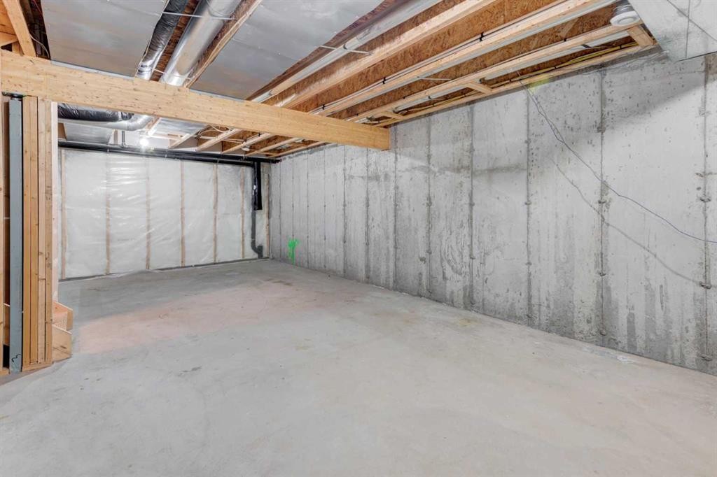 127 Prestwick Villas Se, Calgary, AB - Indoor Photo Showing Basement