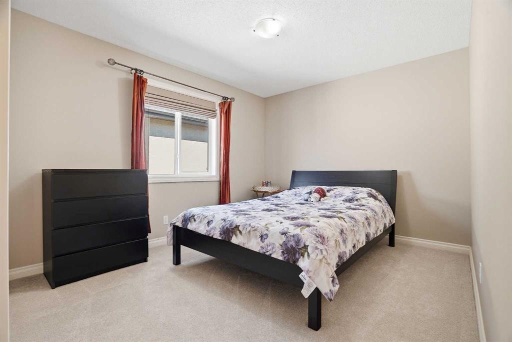 133 Aspen Stone Road Sw, Calgary, AB - Indoor Photo Showing Bedroom