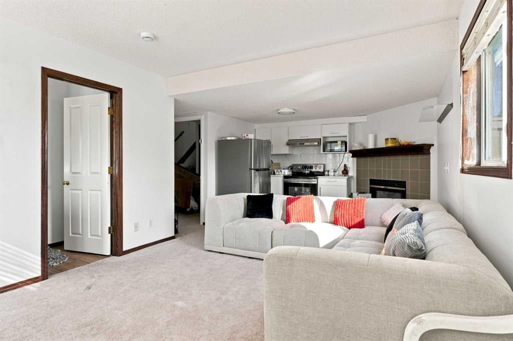 279 Coral Springs Circle Ne, Calgary, AB - Indoor Photo Showing Other Room With Fireplace
