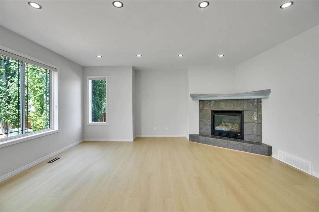 191 Cranwell Crescent Se, Calgary, AB - Indoor Photo Showing Living Room With Fireplace