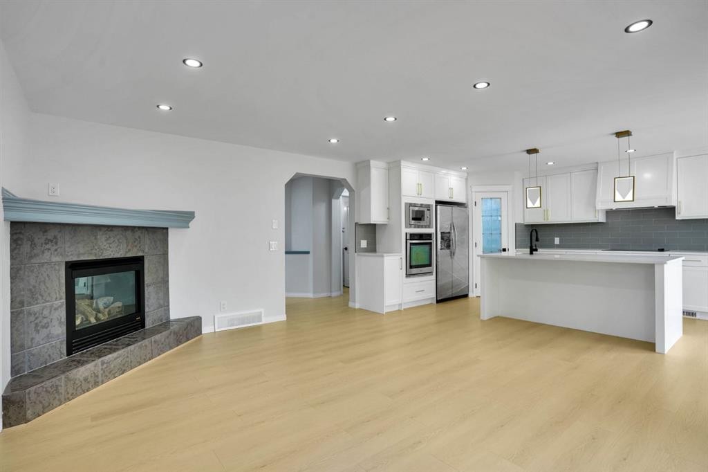 191 Cranwell Crescent Se, Calgary, AB - Indoor With Fireplace