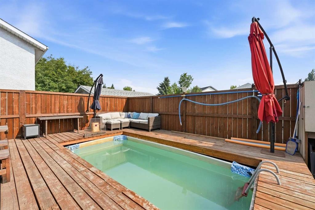 96 Rivercrest Crescent Se, Calgary, AB - Outdoor With In Ground Pool With Deck Patio Veranda