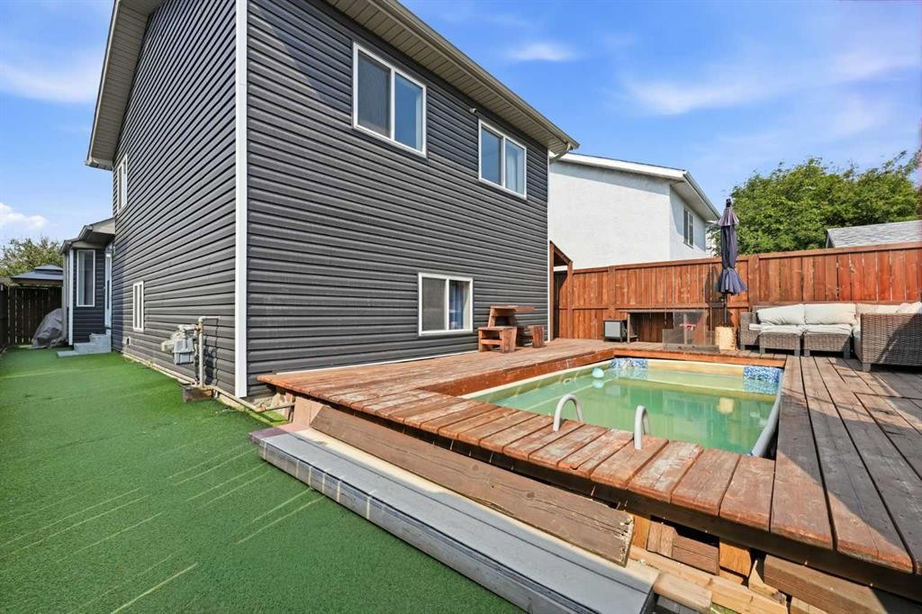 96 Rivercrest Crescent Se, Calgary, AB - Outdoor With In Ground Pool With Exterior