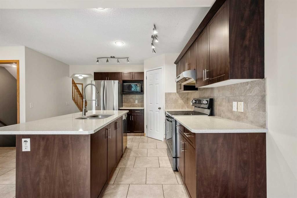 115 Macewan Park Circle, Calgary, AB - Indoor Photo Showing Kitchen With Double Sink With Upgraded Kitchen