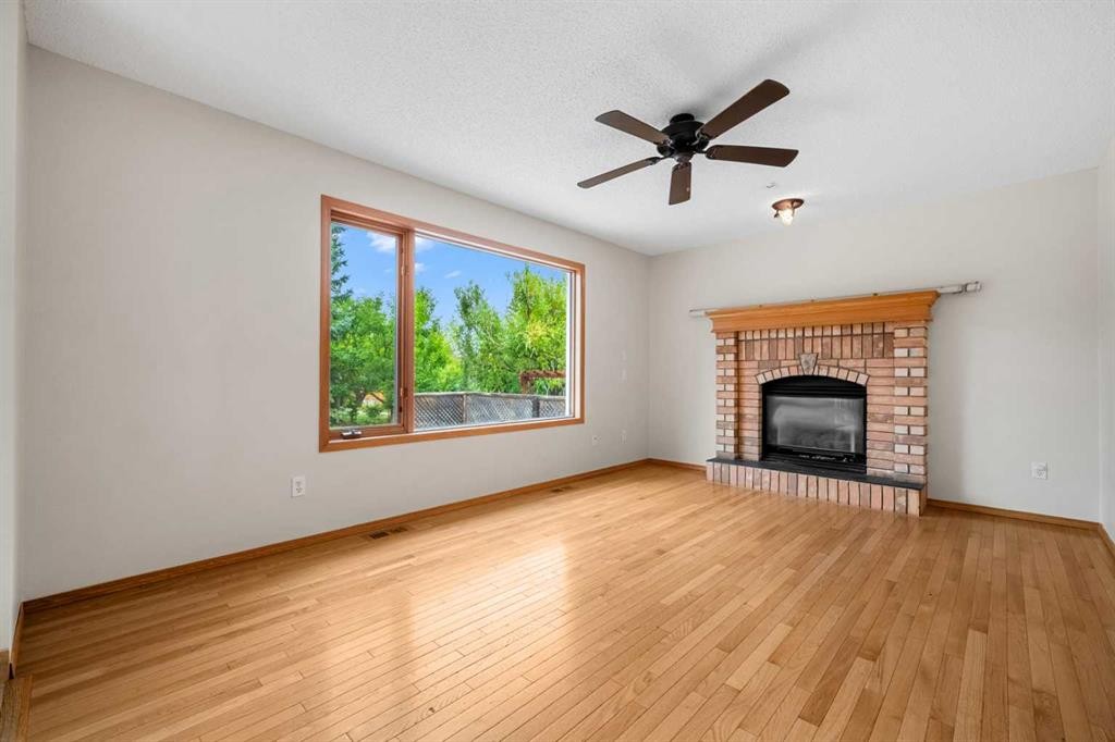 115 Macewan Park Circle, Calgary, AB - Indoor Photo Showing Living Room With Fireplace