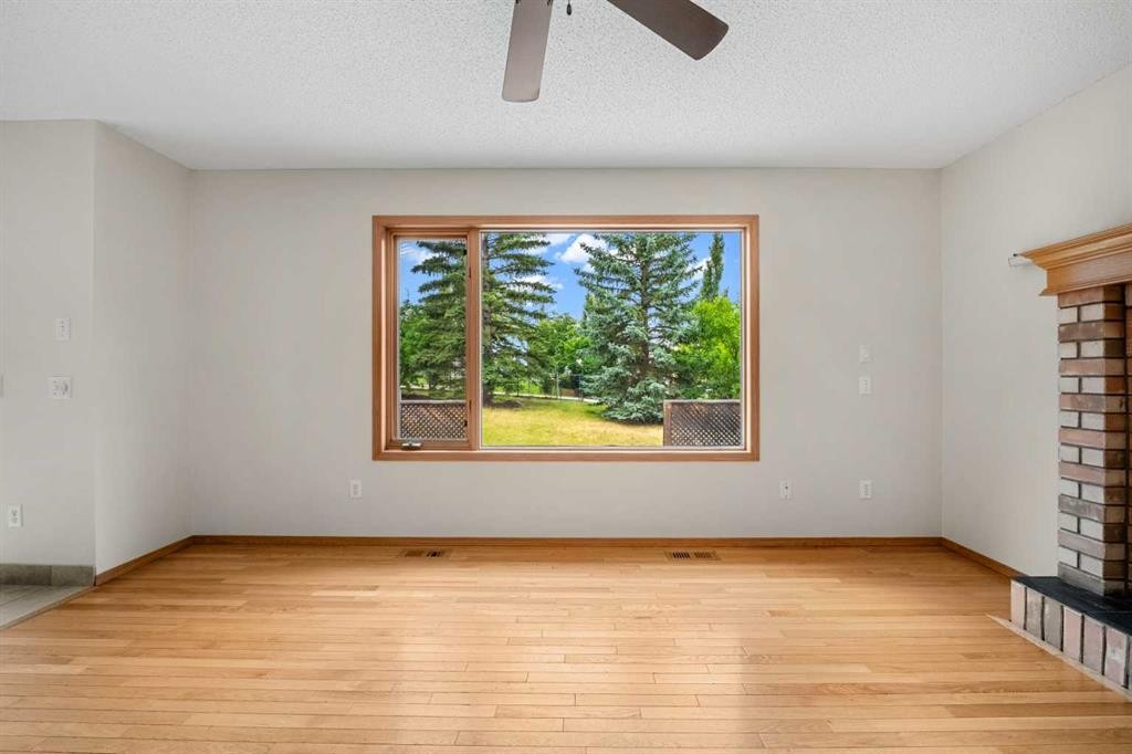 115 Macewan Park Circle, Calgary, AB - Indoor Photo Showing Other Room With Fireplace