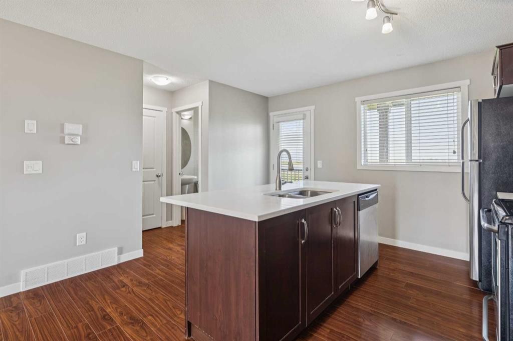 409 Copperpond Landing Se, Calgary, AB - Indoor Photo Showing Kitchen With Double Sink
