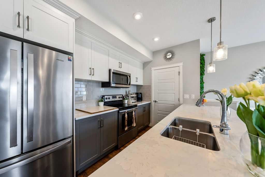 116 Savanna Walk Ne, Calgary, AB - Indoor Photo Showing Kitchen With Double Sink With Upgraded Kitchen