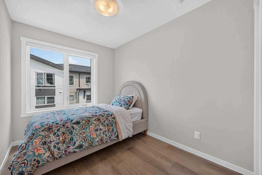 709-474 Seton Circle Se, Calgary, AB - Indoor Photo Showing Bedroom