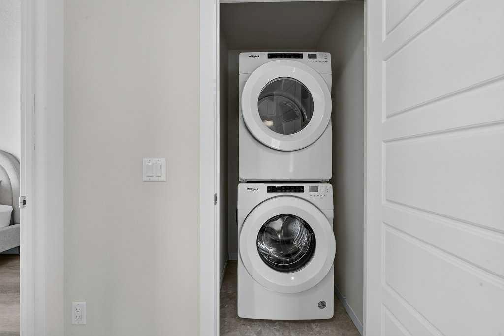 709-474 Seton Circle Se, Calgary, AB - Indoor Photo Showing Laundry Room