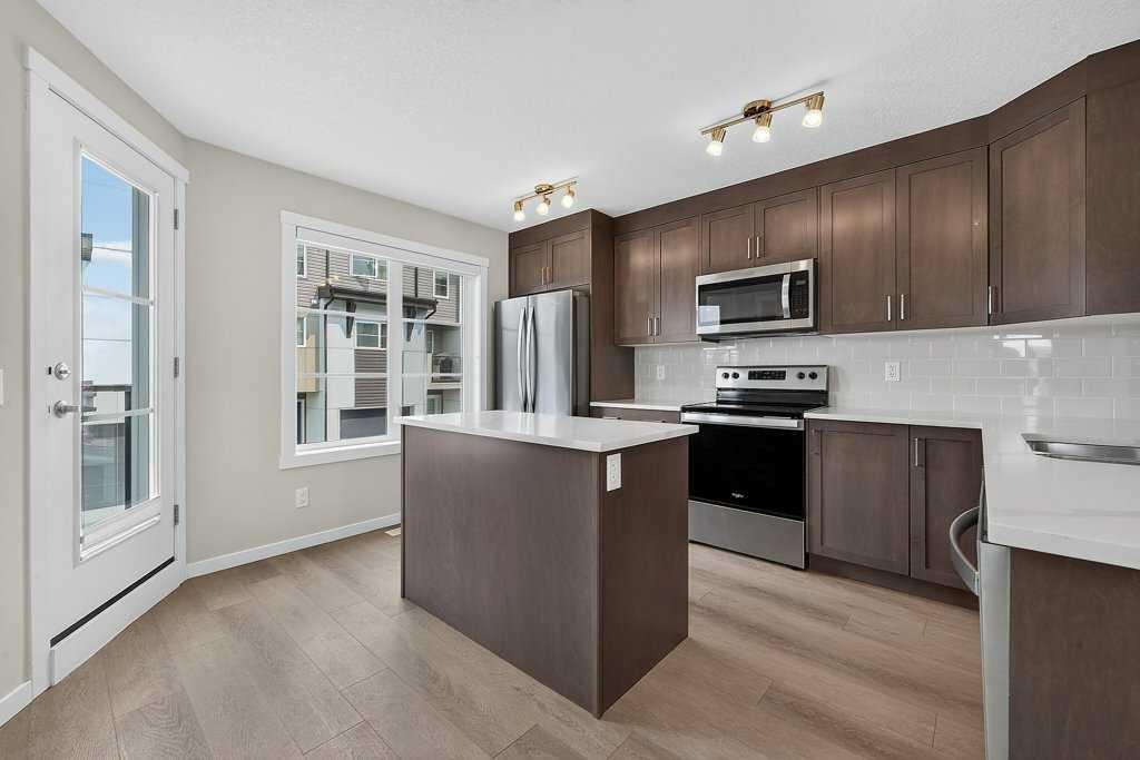 709-474 Seton Circle Se, Calgary, AB - Indoor Photo Showing Kitchen With Stainless Steel Kitchen With Upgraded Kitchen