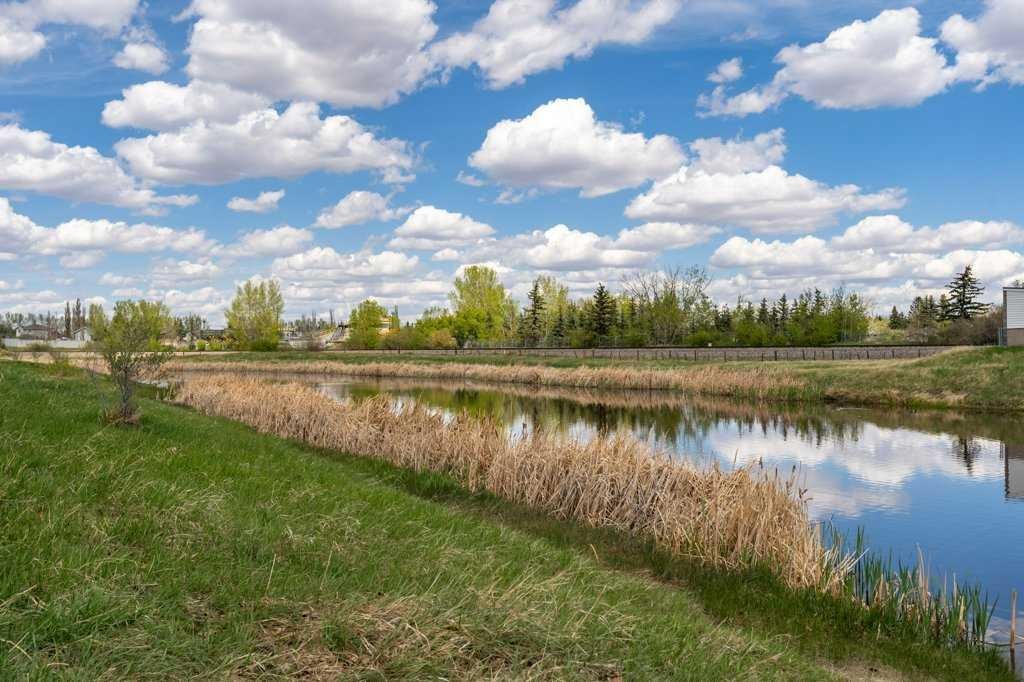 202 Willowbrook Close Nw, Airdrie, AB - Outdoor With Body Of Water With View