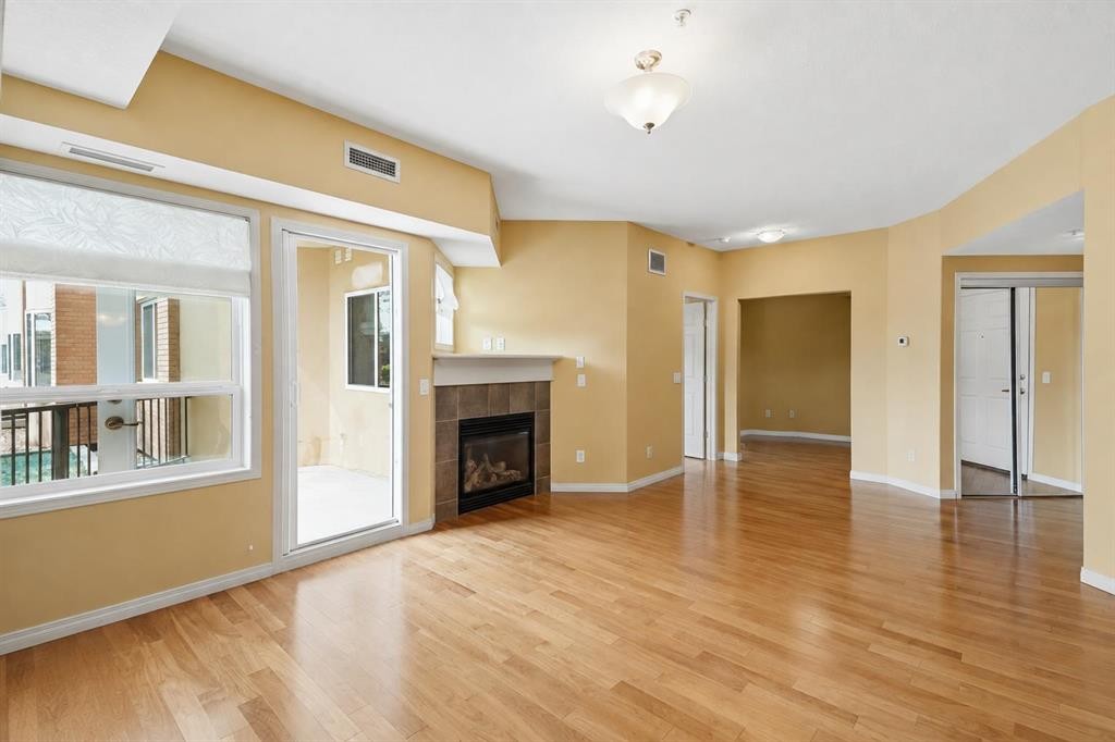 2144-48 Inverness Gate Se, Calgary, AB - Indoor Photo Showing Living Room With Fireplace