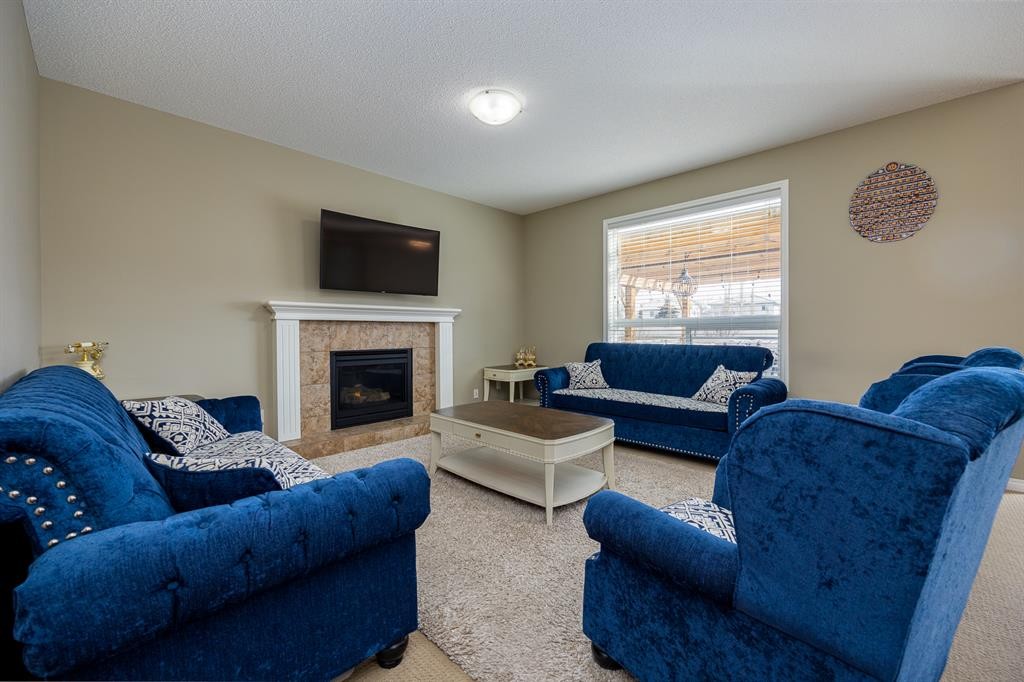 462 Williamstown Green Nw, Airdrie, AB - Indoor Photo Showing Living Room With Fireplace