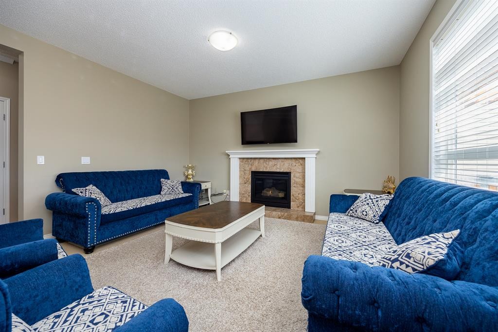 462 Williamstown Green Nw, Airdrie, AB - Indoor Photo Showing Living Room With Fireplace